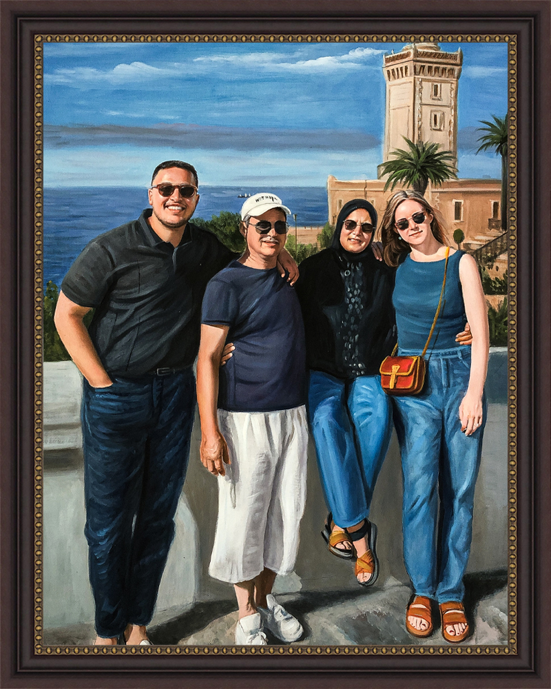 Framed family portrait of four people by the sea with a lighthouse